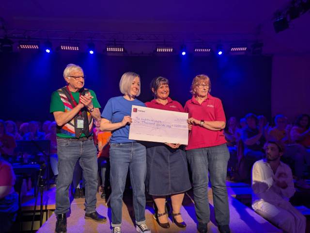 EBM Committee Members presenting giant cheque to Lighthouse Centre staff.